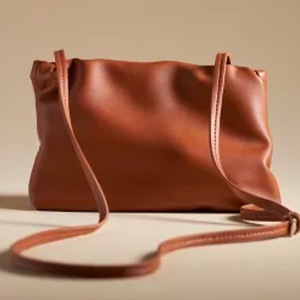 BY ANTHROPOLOGIE CINCHED FAUX-LEATHER CLUTCH Style No. 93776441 COPPER